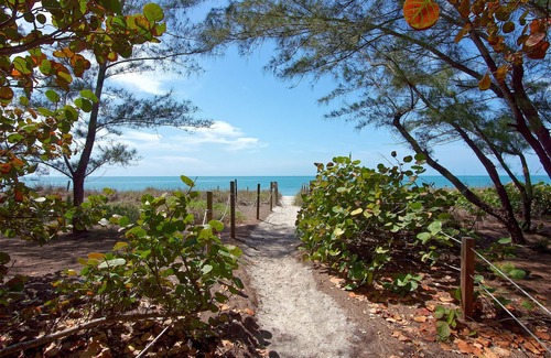 Captiva Cottage | Charming, First Class, Fenced and Gated, Truly Beachfront! Golf cart included.
