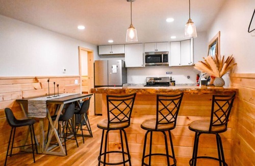Boyne Falls Cabin | Charming Red Cabin in the woods. A perfect stay just 3 min from ski resort! n