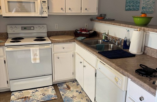 Bel Air House | Charming retreat across from Beach access 18 and steps to local attractions.
