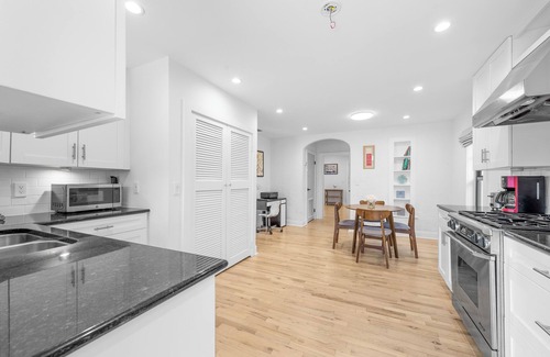 Old Northwood House | Chic 4BR retreat with private pool and modern amenities. Detached guest house includes queen bed, full bath, and kitchen. Minutes from downtown West Palm Beach, Palm Beach Island, Northwood Village, and Palm Beach Outlets.