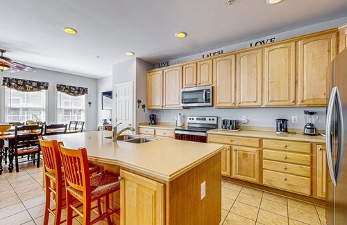 Sunset Island House | Coastal retreat with beach and shared pool - balconies, AC, & W/D