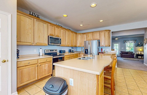 Sunset Island House | Coastal retreat with beach and shared pool - balconies, AC, & W/D