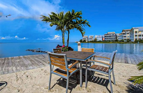 Sunset Island House | Coastal retreat with beach and shared pool - balconies, AC, & W/D