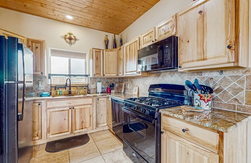 El Prado House | Colorful music-themed home with mountain views, hot tub, woodstove & WIFI