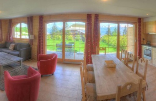 Anzere Apartment | Contemporary flat with a garden. Warmly decorated; a large living room with a dining room and a bea