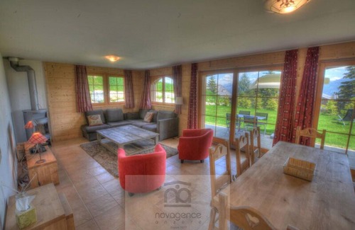 Anzere Apartment | Contemporary flat with a garden. Warmly decorated; a large living room with a dining room and a bea