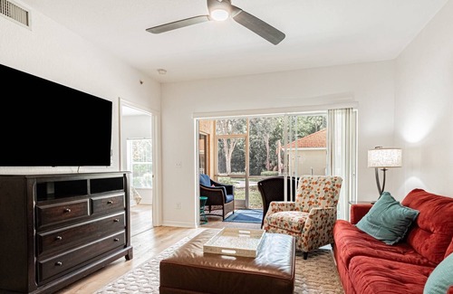 Ole Condo | Coral Falls - 1st floor condo - private screened lanai w/views of indoor 65" TV & steps to pool/spa