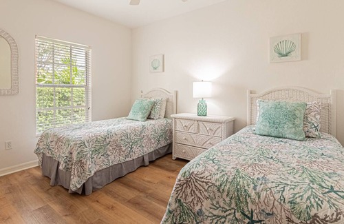 Ole Condo | Coral Falls - 1st floor condo - private screened lanai w/views of indoor 65" TV & steps to pool/spa