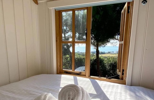 Les Vinaires Cabin | Cosy Shepherd Hut with wood burner and radiator - panoramic sea views!