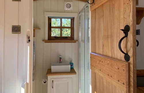 Les Vinaires Cabin | Cosy Shepherd Hut with wood burner and radiator - panoramic sea views!