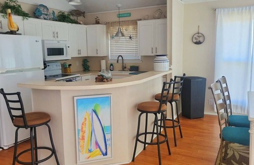 Surfside Beach House | Cozy and Clean steps from the beach. Gulf views <3