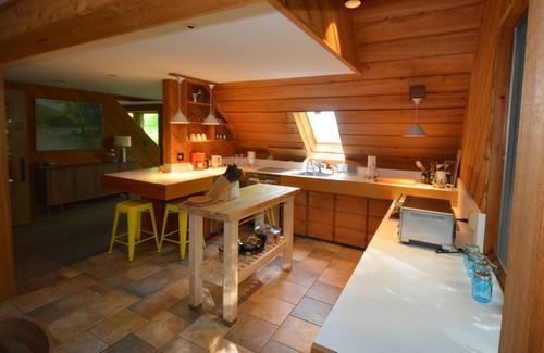 Suttons Bay Cabin | Cozy cottage high in the trees. Walk to the beach. Small dog considered.
