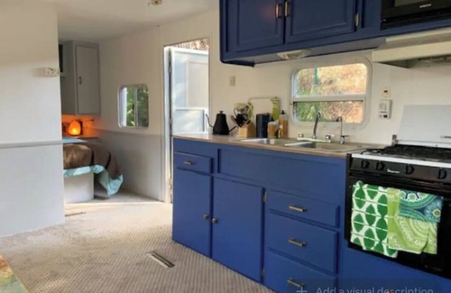 Topanga House | Cozy Mallard RV. Light, bright and inspiring trailer amongst the Pine trees.