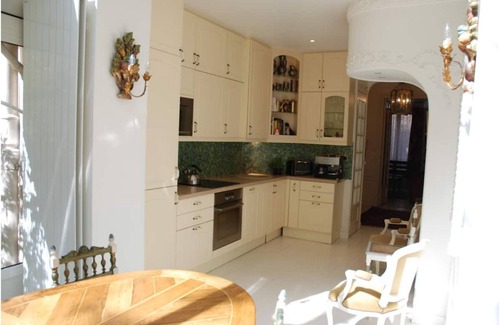 16th Arrondissement Apartment | Cozy Parisian style apartment with a veranda overlooking a private garden.