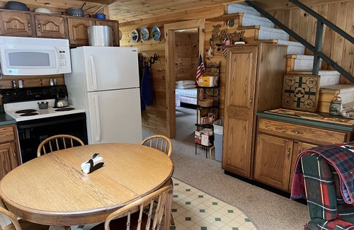 Bowerbank Cottage | Cozy Sebec Lake front cabin with dock and fire pit