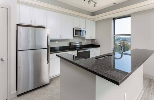 Central Business District Apartment | CozySuites at the Banks gym, pool 16
