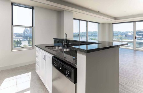 Central Business District Apartment | CozySuites at the Banks gym, pool 16