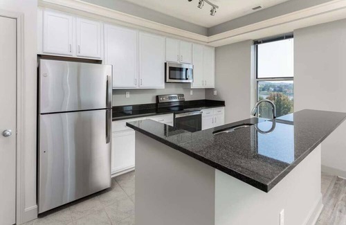 Central Business District Apartment | CozySuites at the Banks gym, pool 14