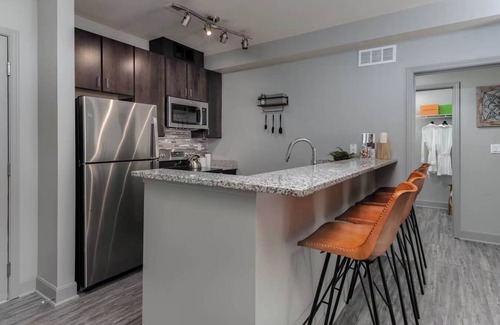 Central Business District Apartment | CozySuites at the Banks gym, pool 11