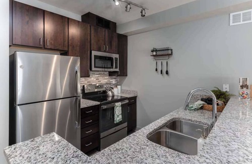 Central Business District Apartment | CozySuites at the Banks gym, pool 11