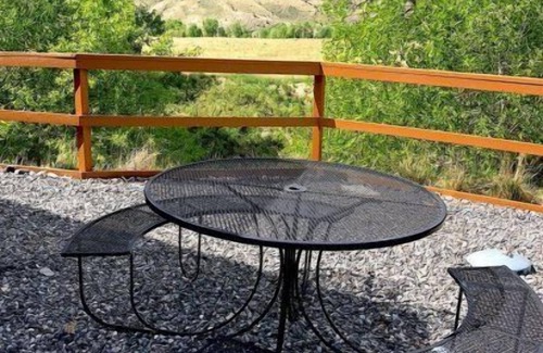 Cody Apartment | Creek Side Cabin #1 in the Wapiti Valley and steps from Trout Creek