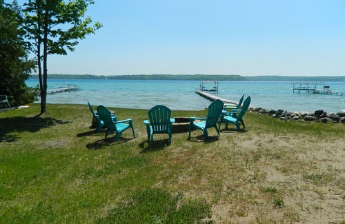Lake Township House | Crystal Lake Waterfront Cottage with Private Dock, Yard, & Hot Tub