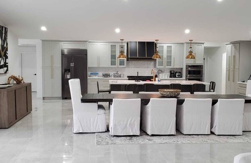 Caloosahatchee House | Custom Home with tile pool, boating dock and every comfort