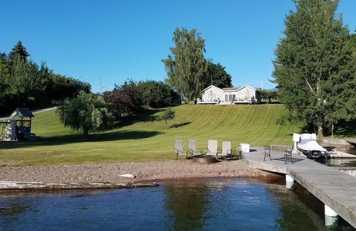 Polson Cottage | Daly Cottage Offers a Beach, Dock, Private Boat Ramp and is Pet Friendly!