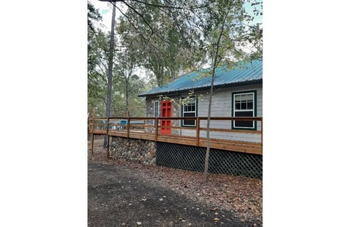 Hawkins House | Dock Holiday is a lakefront home with hot tub. Bring your fishing pole.
