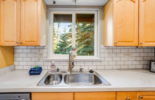 Eagle River House | Dog-friendly home with a fenced yard, putting green, & shared washer/dryer