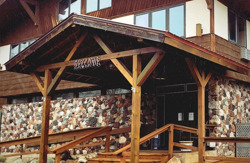 Ironwood Apartment | Dog Friendly main level king room inside the Lodge at North Ironwood Acres resort.