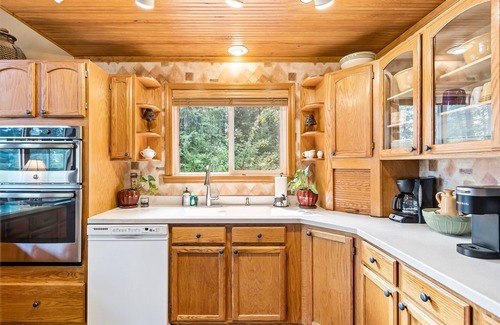 Sandpoint House | Dog-friendly mountain retreat near skiing with lake view, hot tub, & balcony