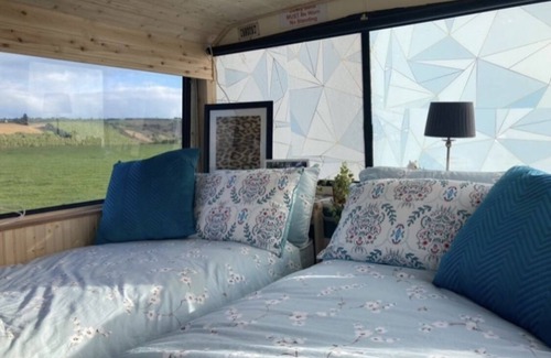 Ballinadee House | Double decker bus and hot tub/bar and patio