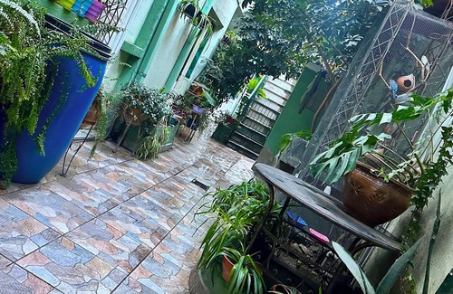 Cochabamba House | Double room with queen size bed and sofa bed, terrace and plants