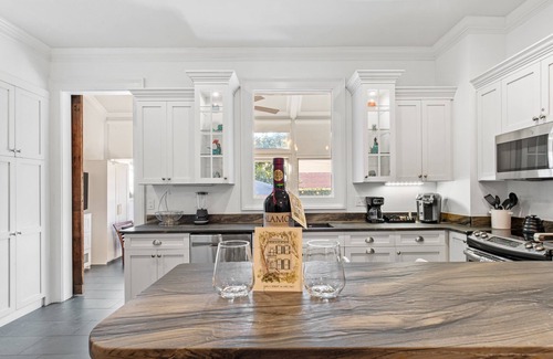 Old West Broad Neighborhood House | Downtown Retreat on Historic Jones Street | Heated Pool Access | By Southern Belle