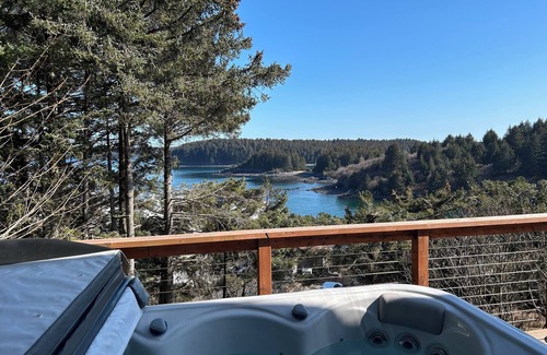 Kodiak House | Enjoy channel views from the hot tub. Minutes walk from downtown and waterfront.