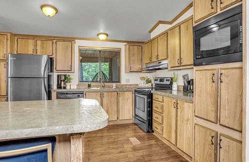 Munds Park Cabin | Escape to Pinewood Canyon Cabin, an inviting 2BR/2BA retreat nestled in the pines of Munds Park. With warm interiors, a relaxing deck with views, and direct forest access, it’s the perfect basecamp for year-round adventure and mountain serenity.
