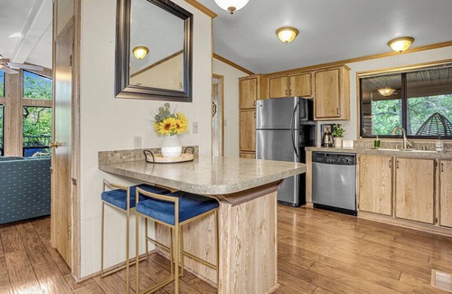 Munds Park Cabin | Escape to Pinewood Canyon Cabin, an inviting 2BR/2BA retreat nestled in the pines of Munds Park. With warm interiors, a relaxing deck with views, and direct forest access, it’s the perfect basecamp for year-round adventure and mountain serenity.