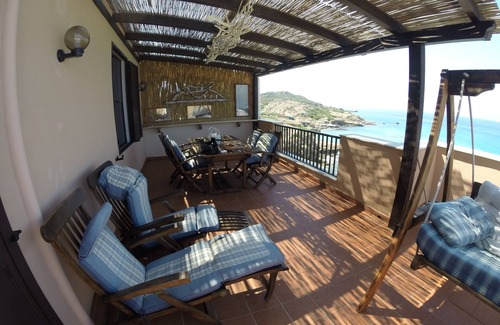 Alghero Apartment | Exclusive penthouse overlooking the sea . with deserted beach under the house.