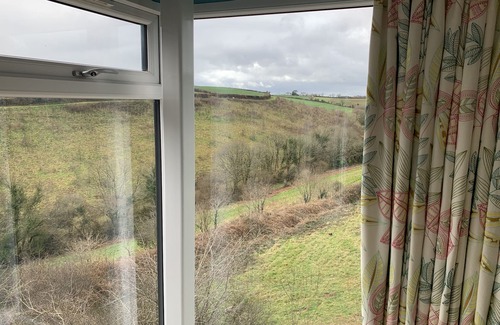 Saltash House | Fabulous barn, tennis court,wood fired hot tub tucked away on working farm