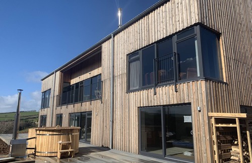 Saltash House | Fabulous barn, tennis court,wood fired hot tub tucked away on working farm