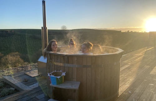 Saltash House | Fabulous barn, tennis court,wood fired hot tub tucked away on working farm