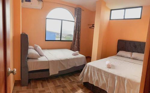 Puerto Baquerizo Moreno Apartment | Family Apartment in San Cristóbal with 2 Bedrooms, 4 Beds, Living Room, Dining Area, Kitchen, Satellite WiFi and 1 Bathroom with Hot Water - CoralBay - Galápagos Home