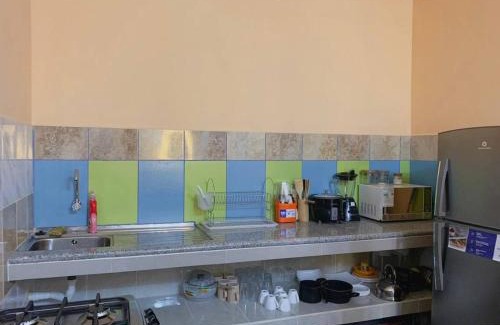 Puerto Baquerizo Moreno Apartment | Family Apartment in San Cristóbal with 2 Bedrooms, 4 Beds, Living Room, Dining Area, Kitchen, Satellite WiFi and 1 Bathroom with Hot Water - CoralBay - Galápagos Home
