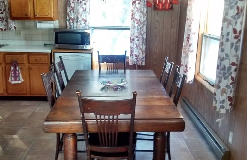 Jim Falls House | Family vacation lake home with a beach, dock, and boats on Fireside Lake.