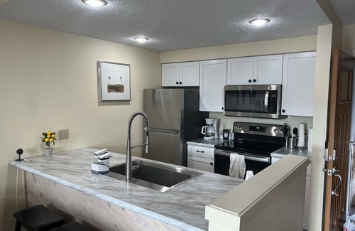 Harbor Springs Condo | Fantastic view of The Highlands! Comfortable 2-bedroom w/loft condo. Come relax.