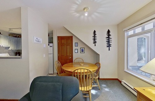 Village North Condo | First-floor condo with fireplace & patio - walk or shuttle to ski lifts
