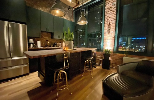 Seaport District Apartment | Fort Point Corner of Windows brick & beam loft