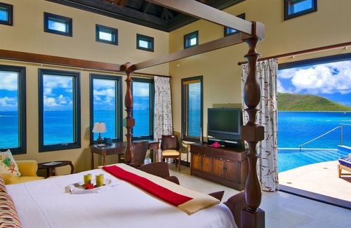 Scrub Island Villa | Four-Bedroom Villa: Luxurious bedrooms and private terraces with ocean views.