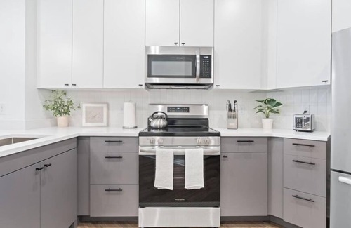 Monroe Ward Apartment | Fresh + Spacious Condo -Downtown RVA- Pool, Gym, Parking Included